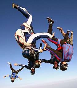 Experienced skydivers doing a head-down formation