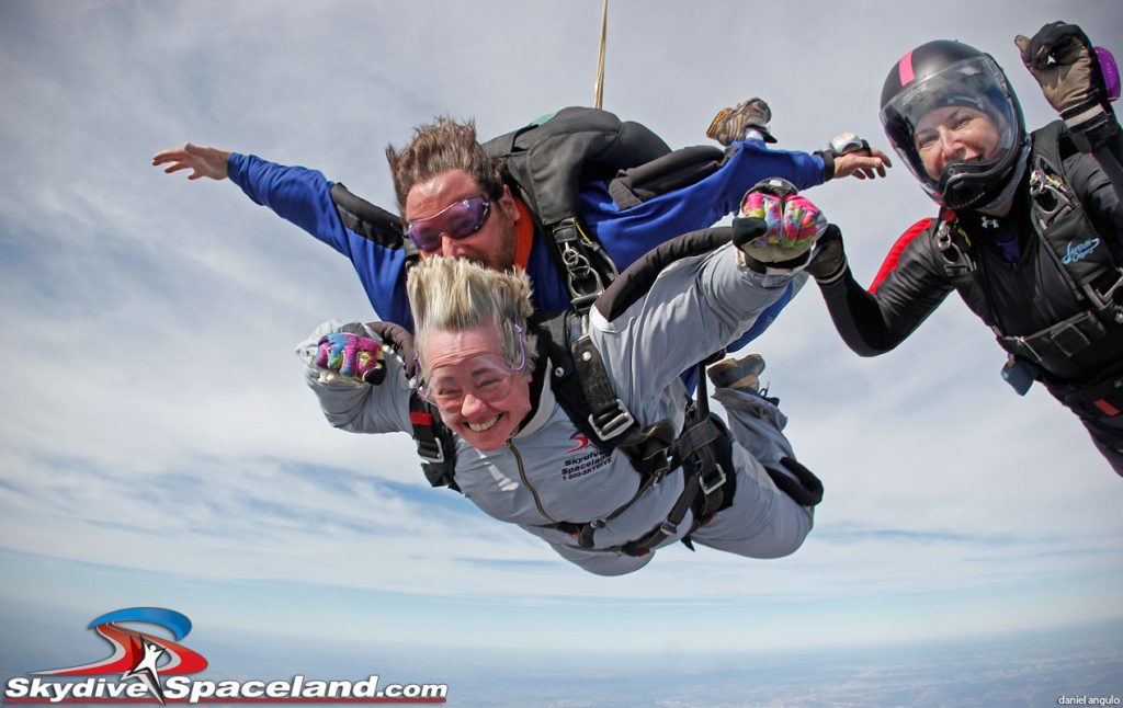 Houston mayor Annise Parker skydiving with instructor Hank Prewitt and Helaine Rumaner